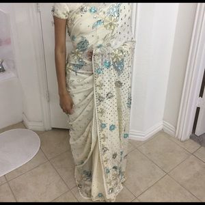 Beige and blue saree.