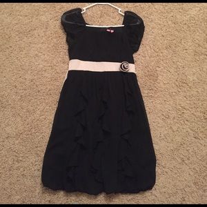 Size 16 kids black dress with a white waist.