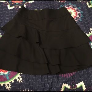 The limited black ruffle mini skirt