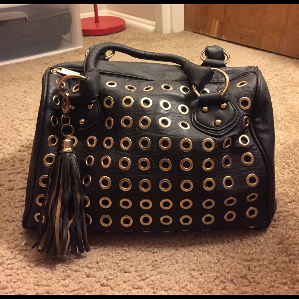 Gold studded black purse