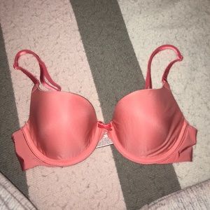 A coral size 32B Victoria's Secret bra