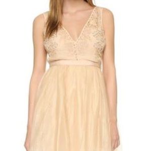 Free people short dress. Gold/blush color. Size 2