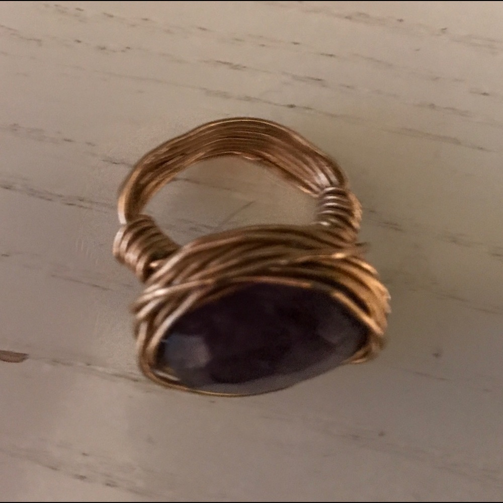 Gold wired ring with purple stone