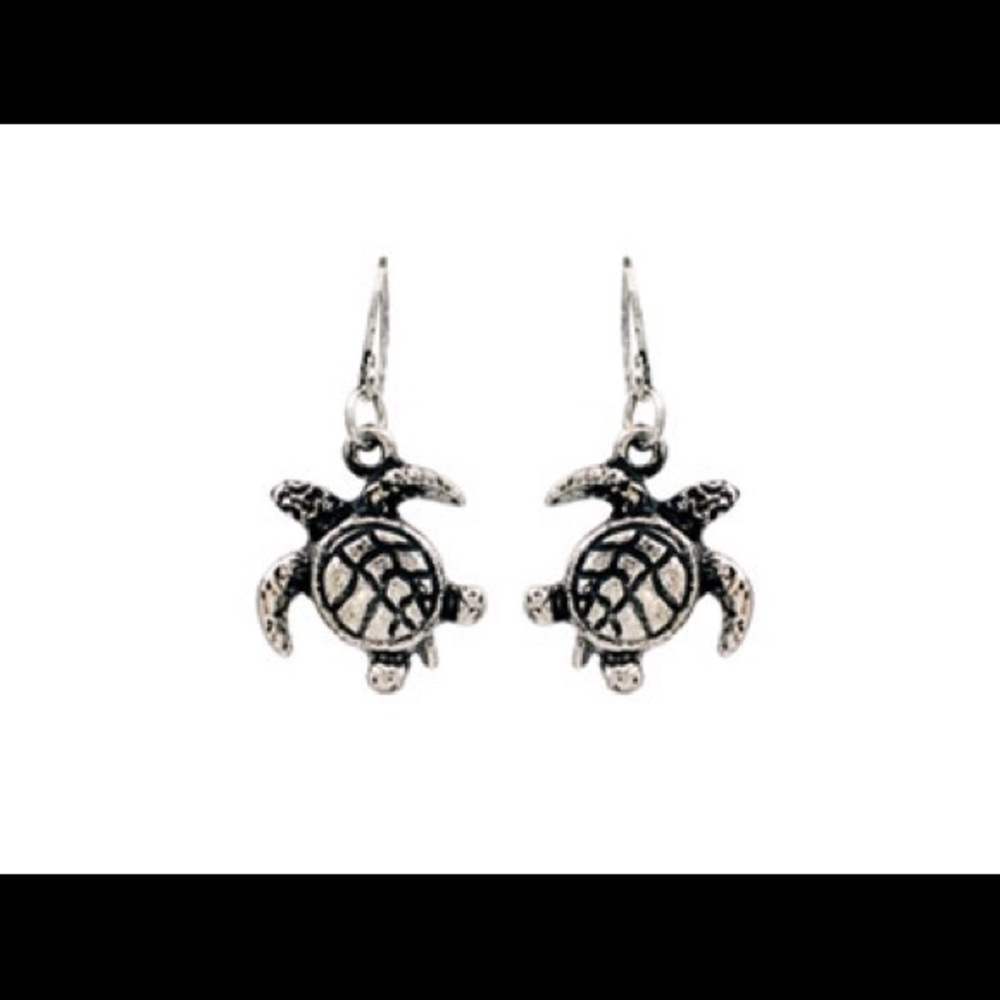 Whimsical silver turtle pierced earrings.