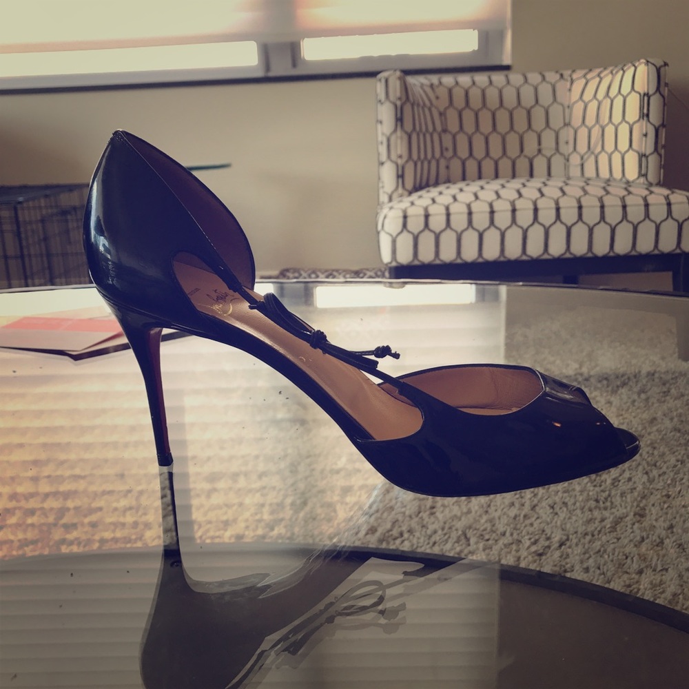 Christian Louboutin black peep toe pumps. Also have in Nude!
