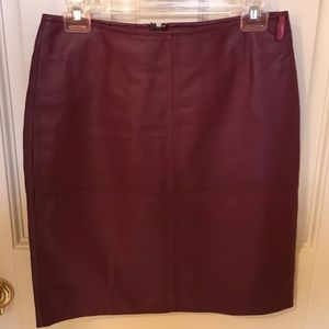 Burgundy leather skirt.