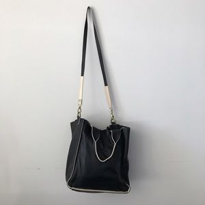100% leather black purse with white details