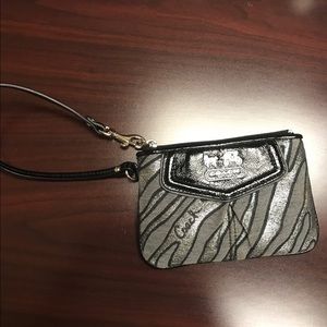 100% authentic Coach wristlet.