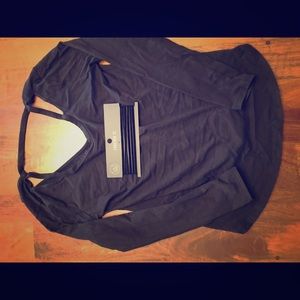 Forever 21 Black long sleeved open shoulder shirt.