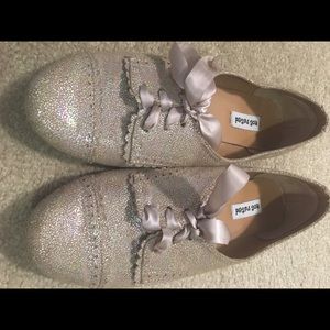 Cute pair of gold tone shoes with ribbon laces.