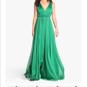 Gown w/ front slit in a pearly crinkle chiffon.