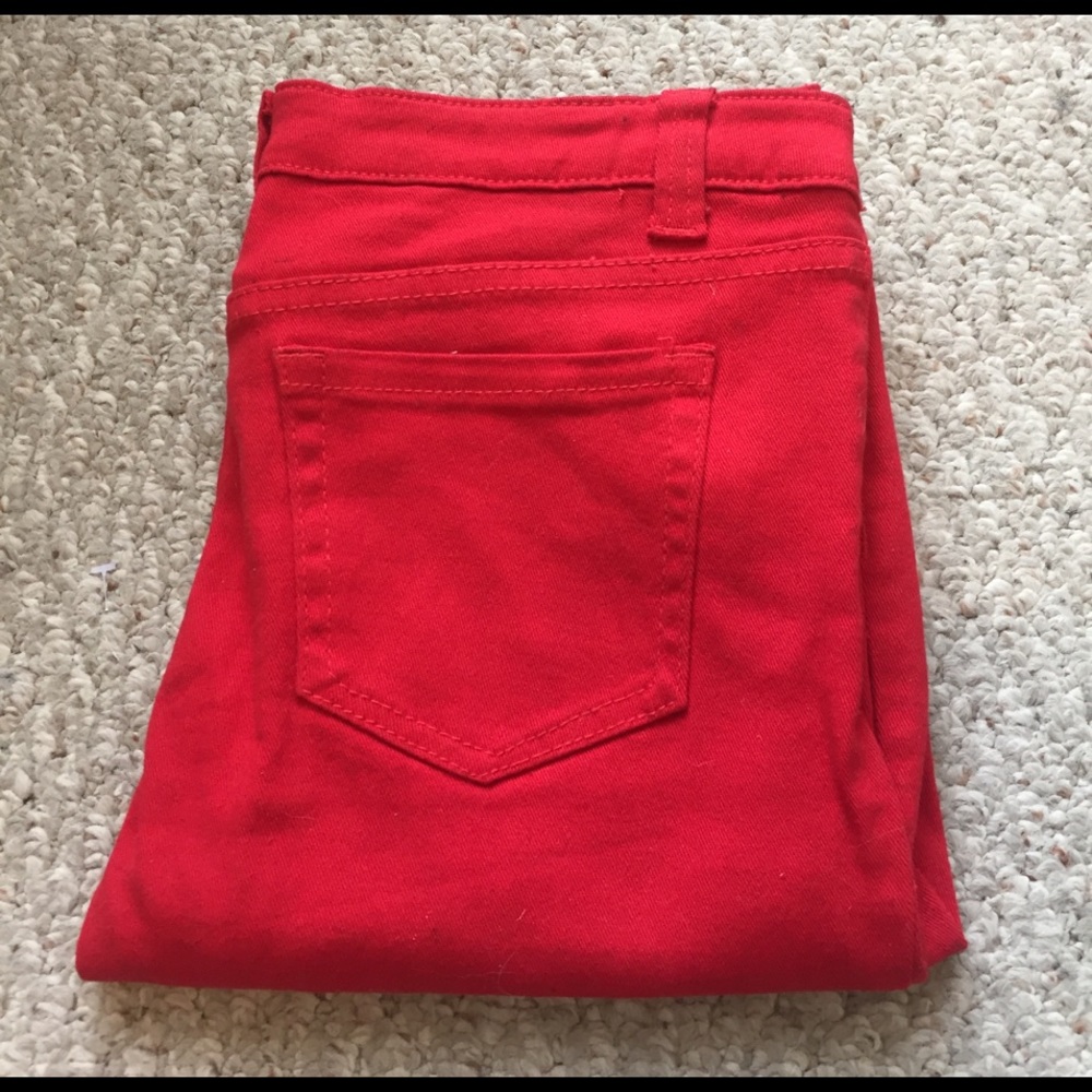 Red Delia's skinny jeans