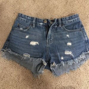 Free people distressed mid rise jean shorts