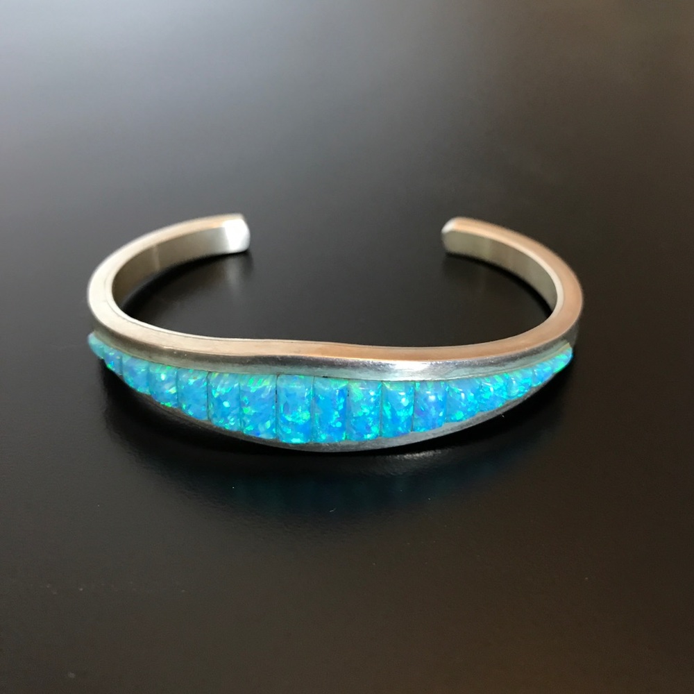 Silver and lab created opal bracelet.