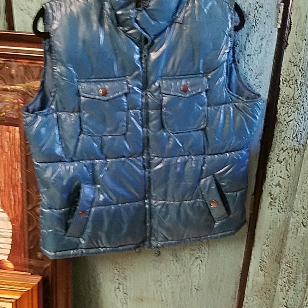 Turquoise winter vest.