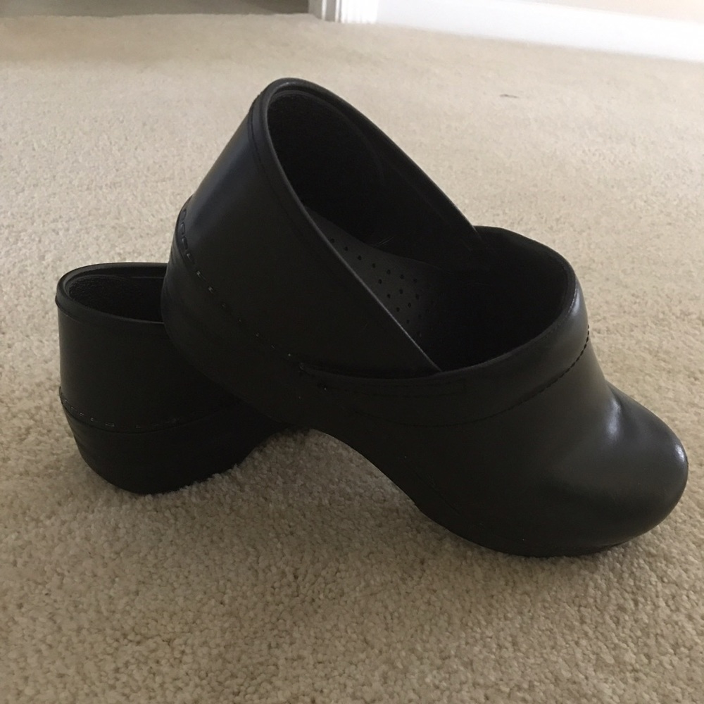 Slightly worn Danskos black professional clogs