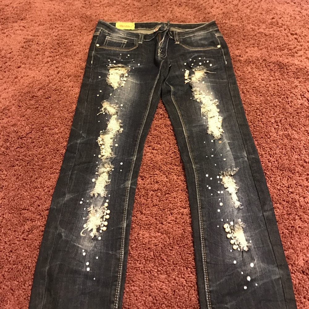 Torn pearl jeans