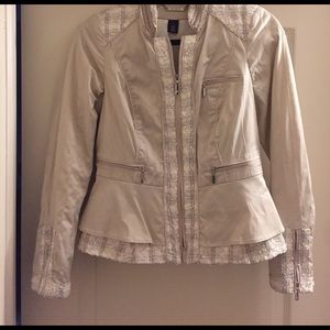 cream satin blazer with silver hardware.