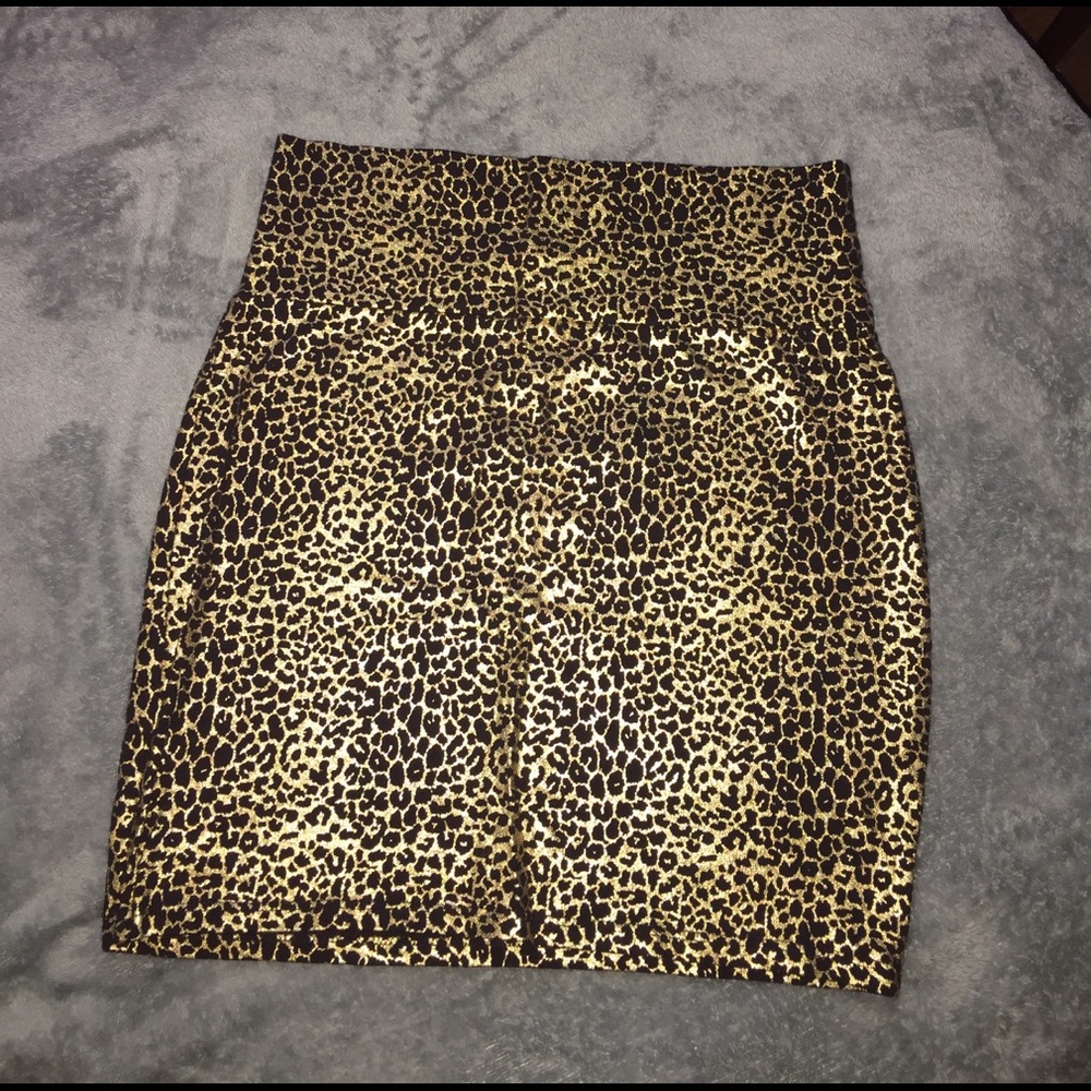 Mini skirt animal print in gold