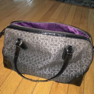 Used black coach purse with silver stitched C's.