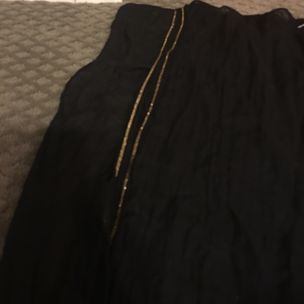 Black scrave with gold trim metal trim