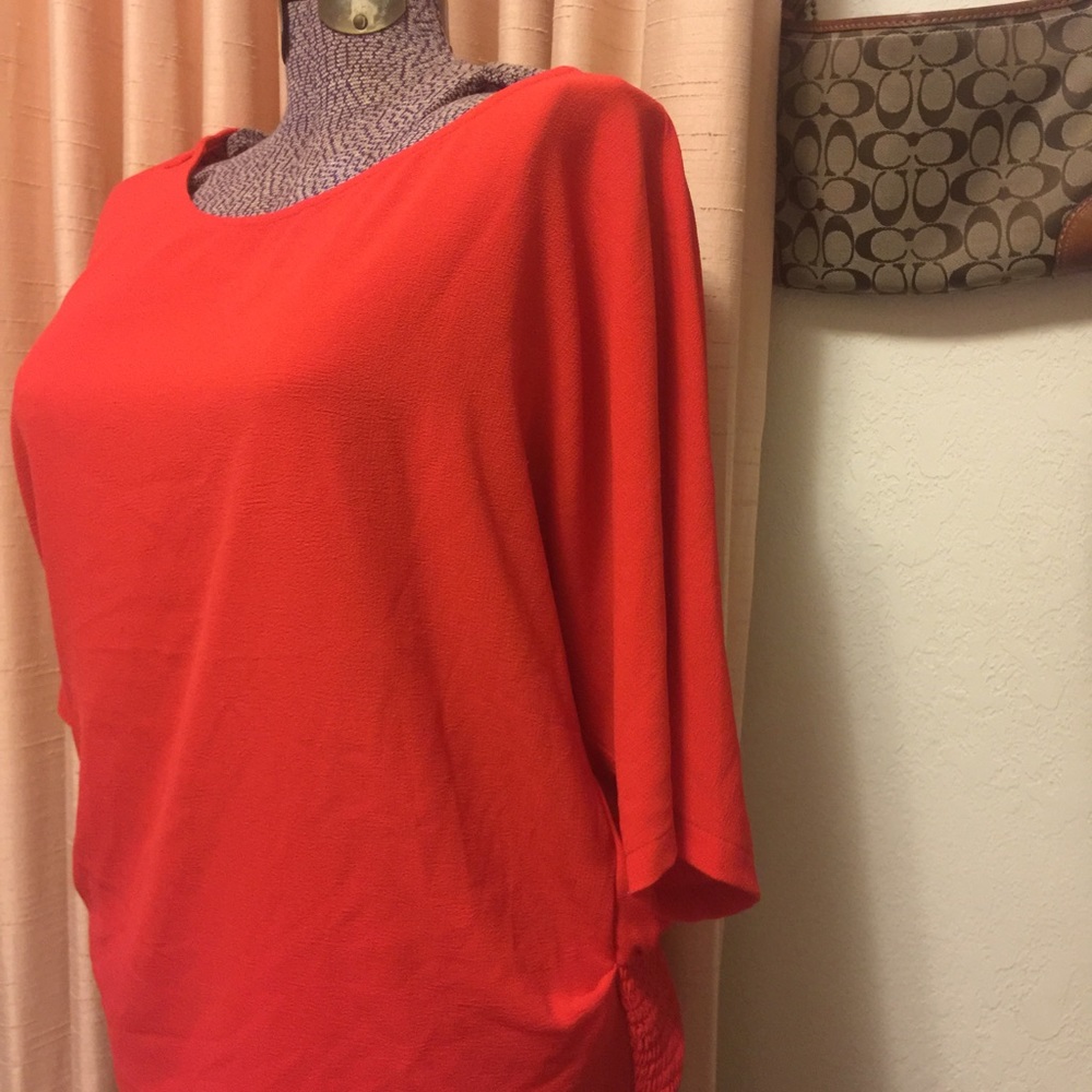 Statement shirt! Bright orange short sleeves.