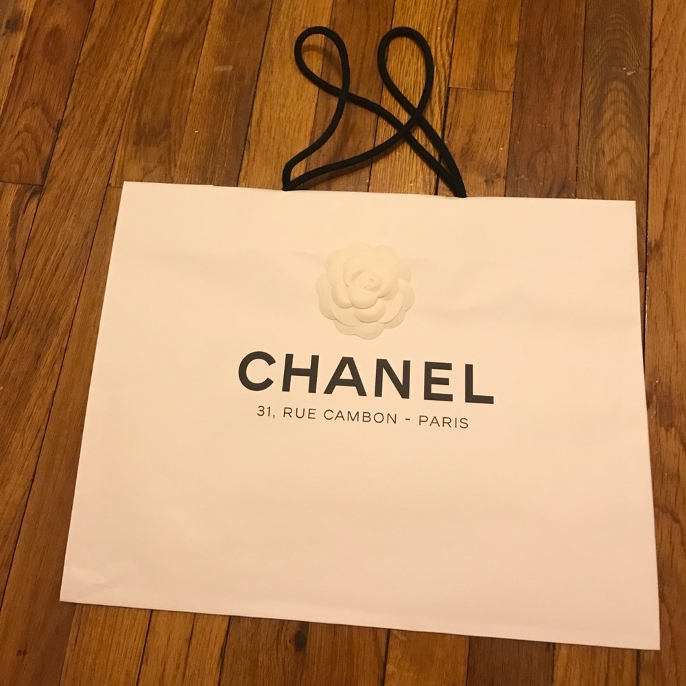 one white large Chanel shopping bag