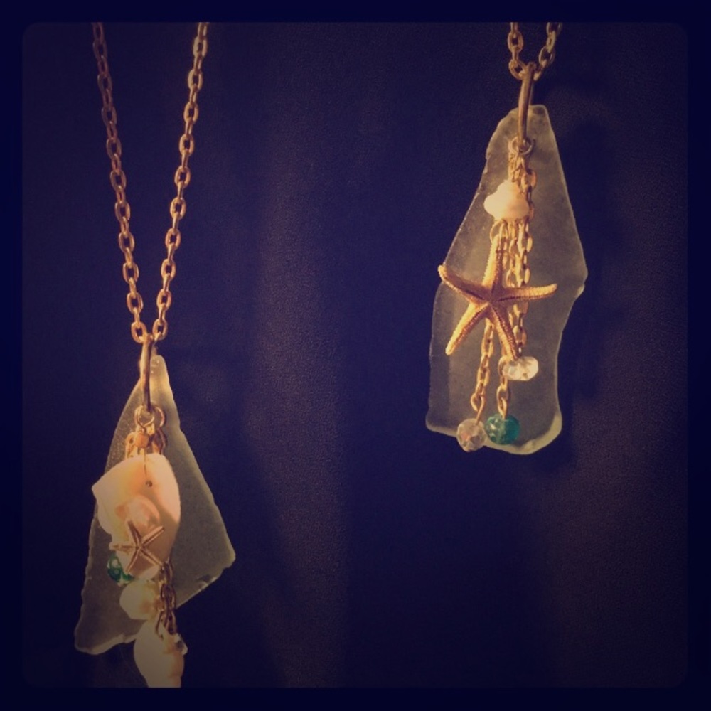 Teal sea glass with natural starfish and shells