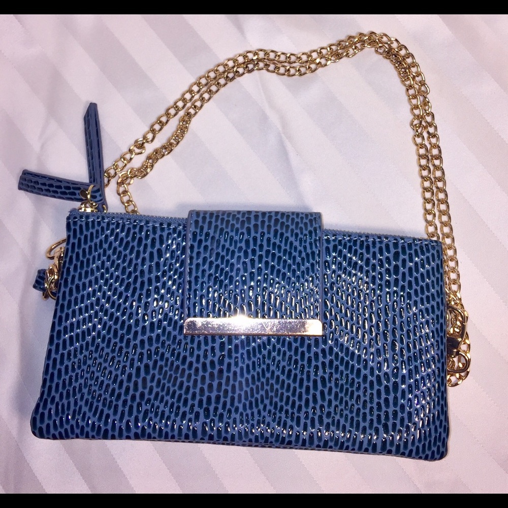 Cross body mini bag/clutch by Olivia Miller.