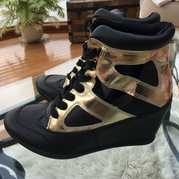 black and gold wedge trainers