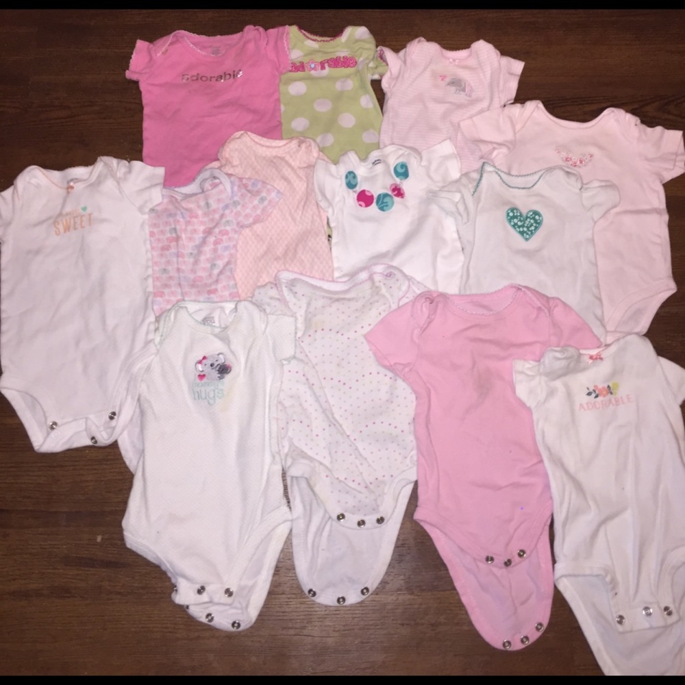 Thirteen 3-6 girl onesies