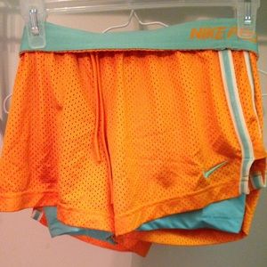 Orange and cyan Nike shorts