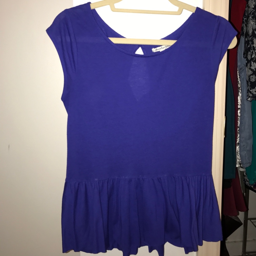 Peplum tshirt with keyhole cutout in the back.