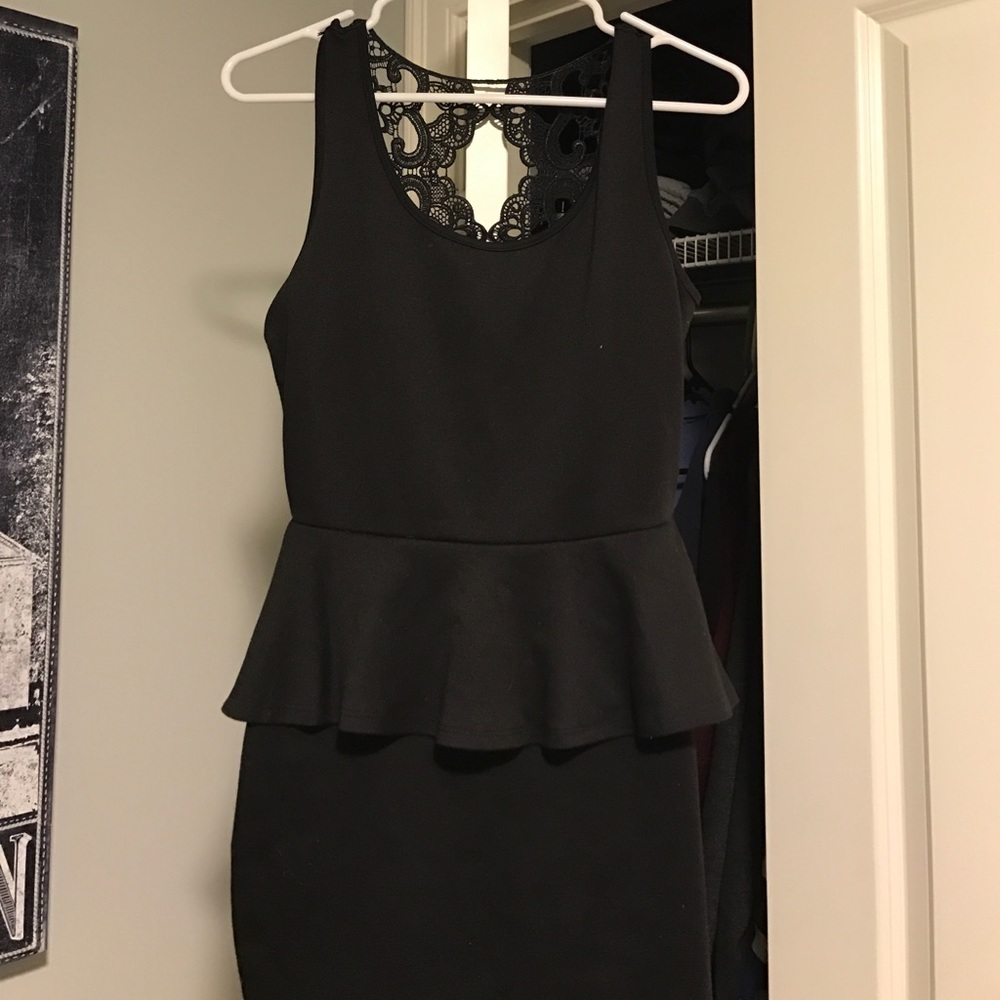 Black dress with peplum style top.