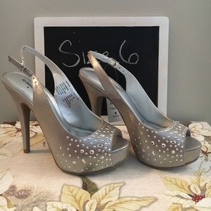 Women's size 6 Silver pumps with high heels
