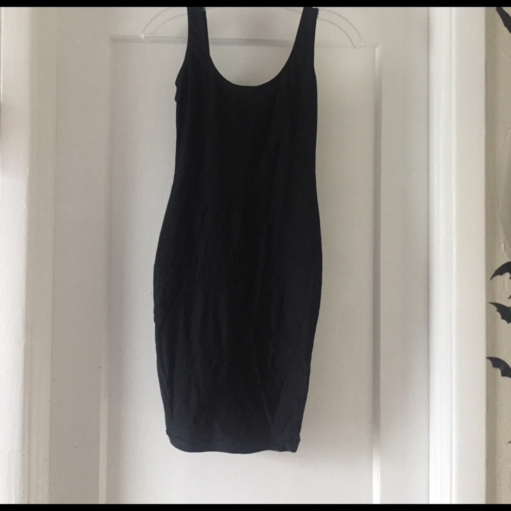 Shiny black dress with open back