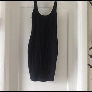 Shiny black dress with open back