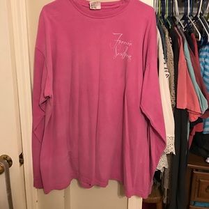 Pink long sleeved t-shirt.