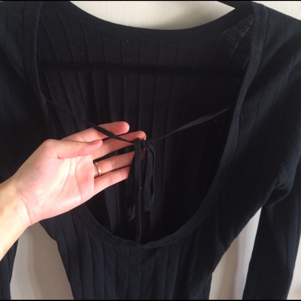 Open low back rubbed black sweater
