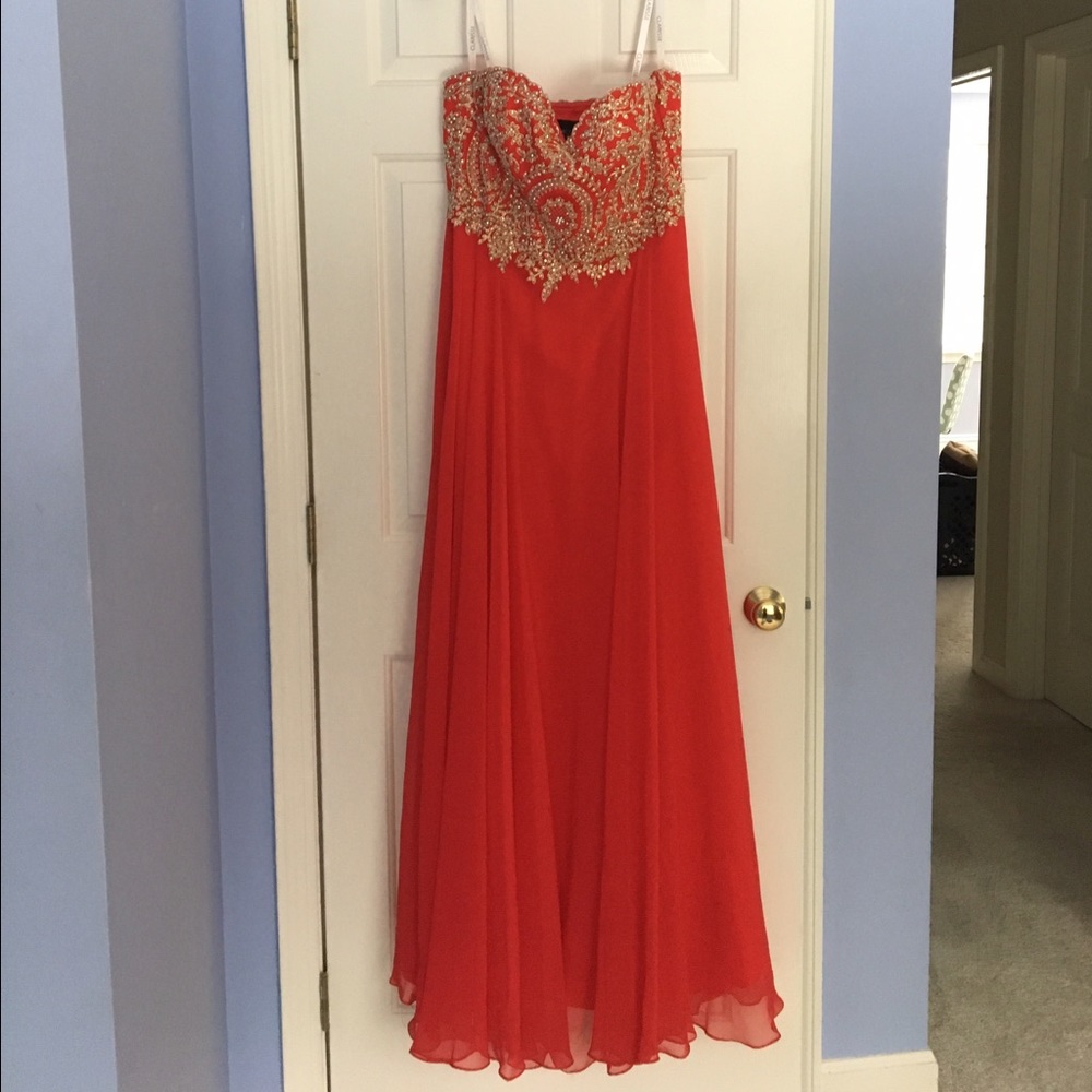 Red strapless prom dress with jeweled top