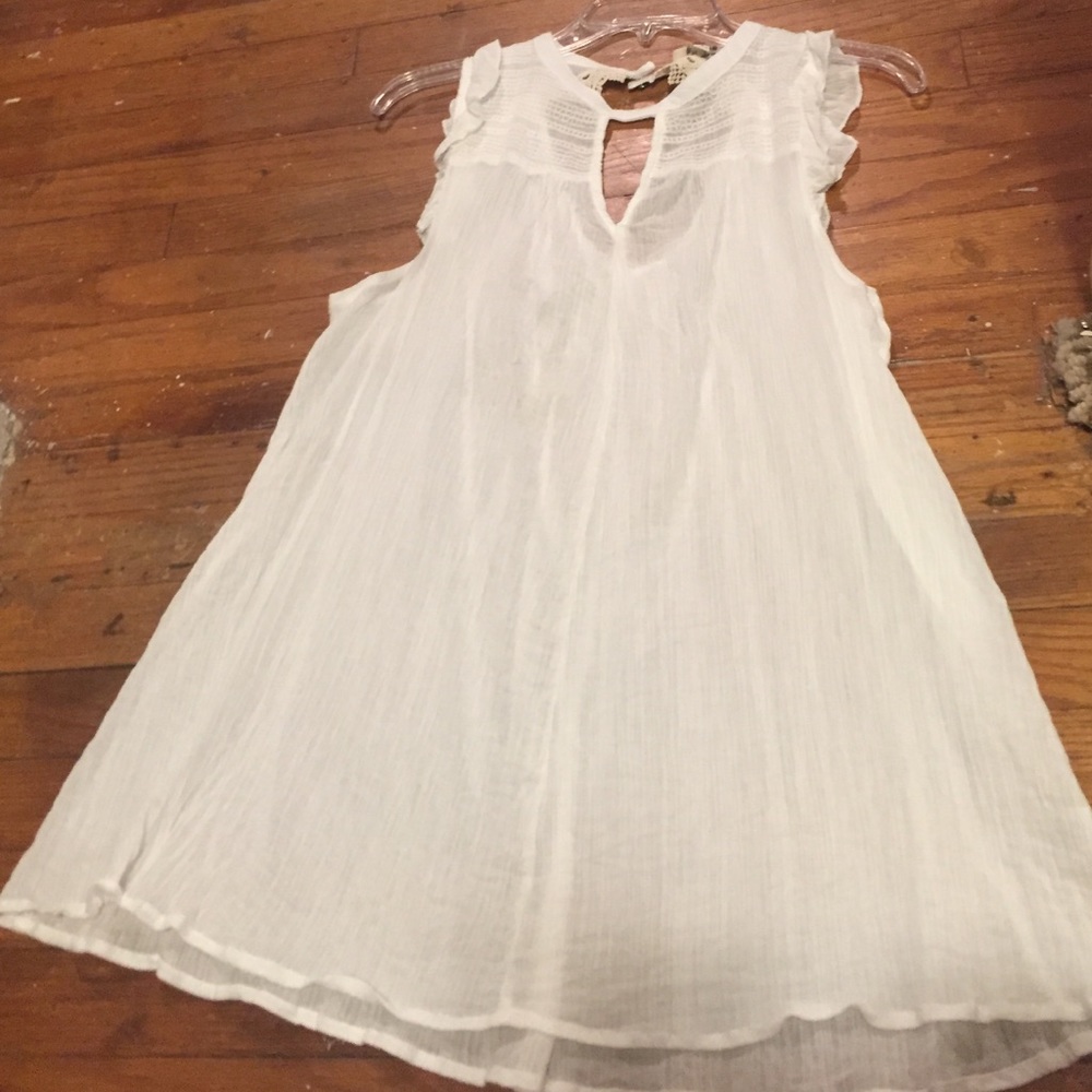 White ruffled tunic!