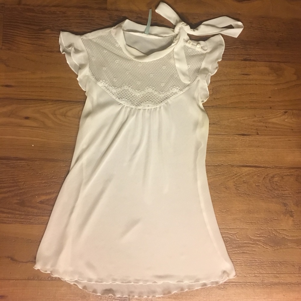 White sheer top with lace scoop neck.