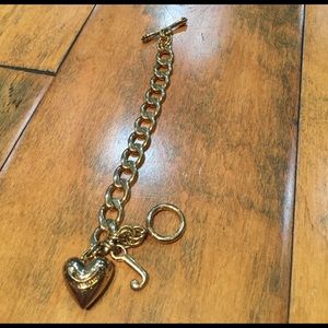 Juicy Couture gold-colored bracelet with charm