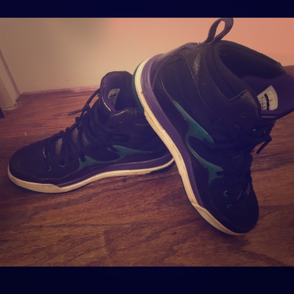 Black teal and purple Jordans