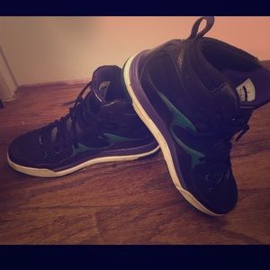 Black teal and purple Jordans