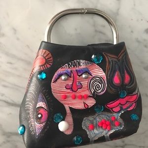 Prada clutch (auth.) tagged by street artist "SESH