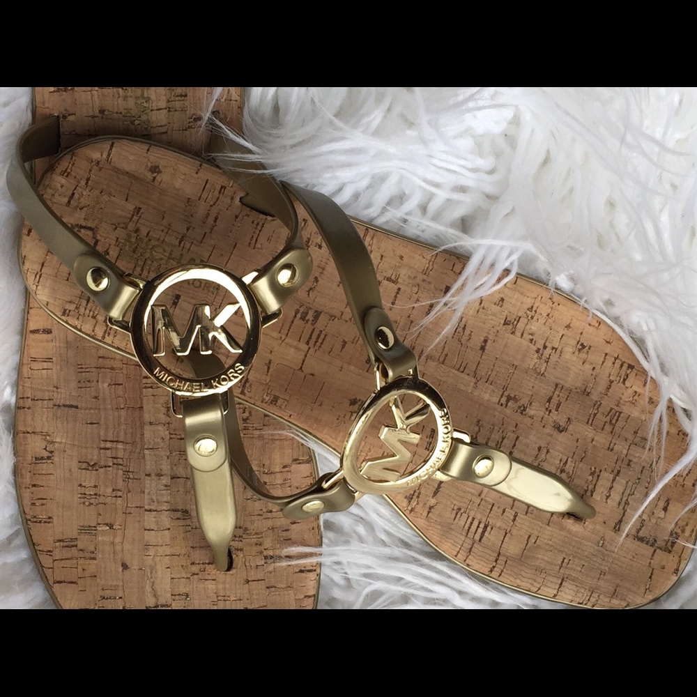 Michael Kors gold/cork flip-flops.
