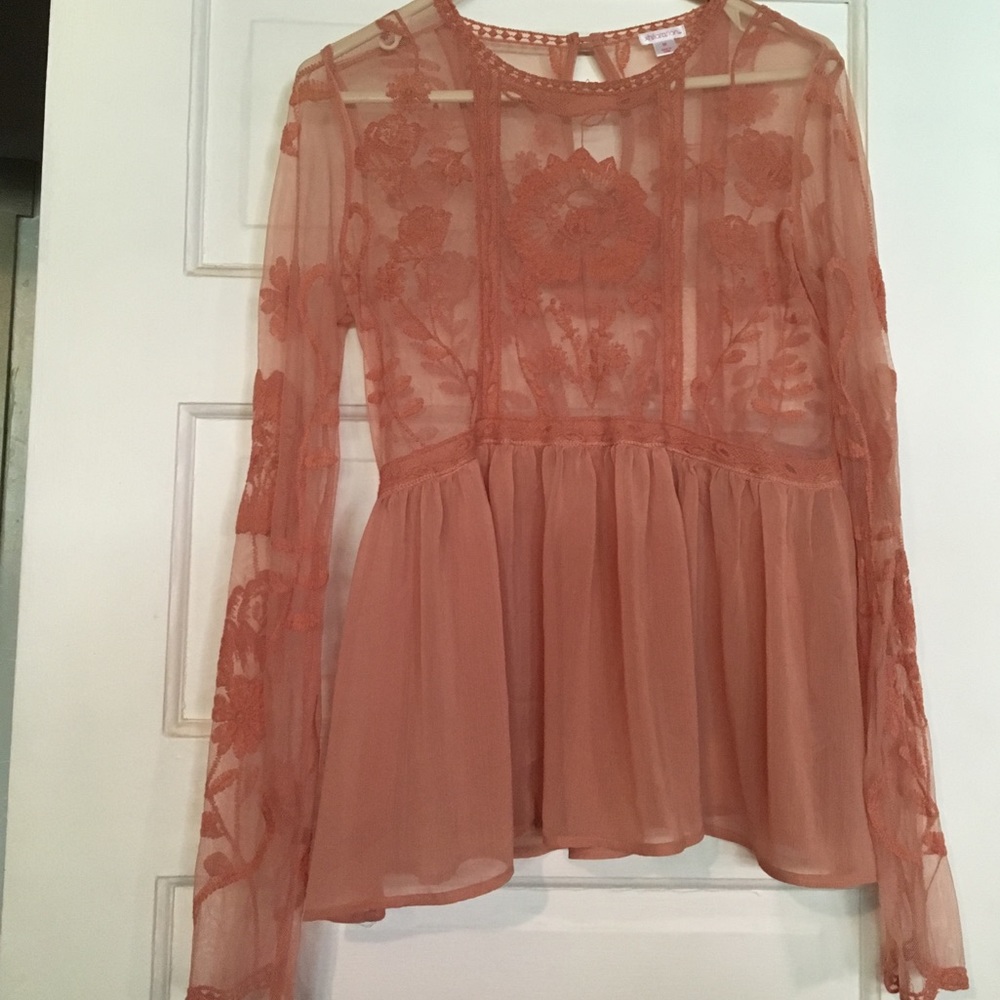 Such a beautiful nude color long sleeve top.