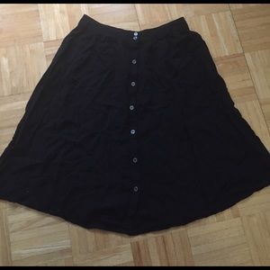 Midi length black skirt