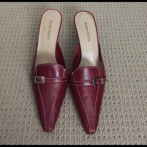 Red leather mules.